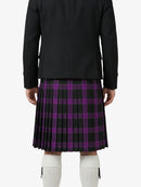 Person wearing a black jacket and purple plaid kilt on a white background