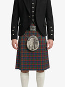 Person wearing a traditional Scottish kilt with a jacket on a white background