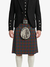 Person wearing a traditional Scottish kilt with a jacket on a white background