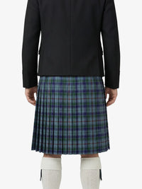 Person wearing a black jacket and plaid kilt on a white background