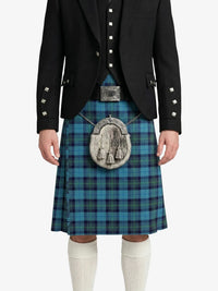 Person wearing a black jacket, blue plaid kilt, and white knee-high socks on a white background