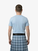 Man wearing a light blue t-shirt and plaid kilt on a white background