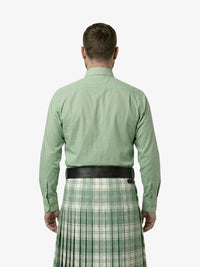 Man wearing a green shirt and plaid kilt on a white background
