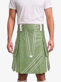 A man wearing a sage green kilt with white geometric stripe details and silver-tone hardware, paired with a white t-shirt, shown from the chest down against a light gray background.