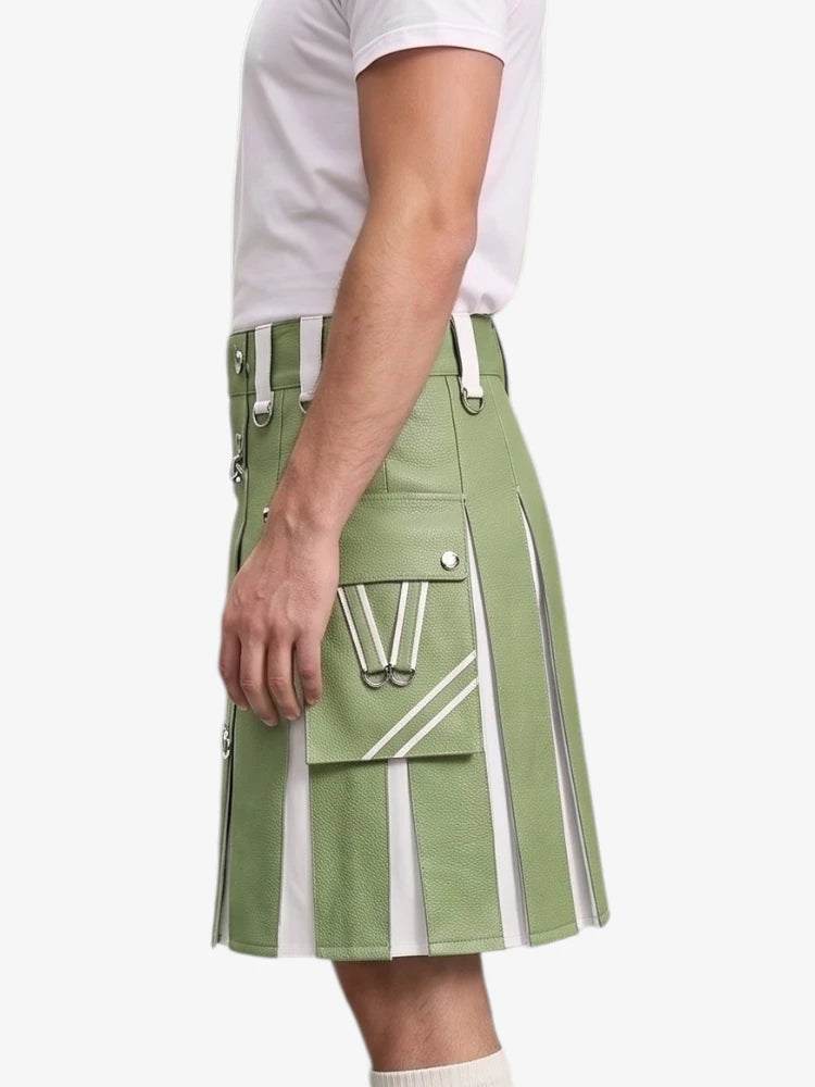 A side view of a model wearing a sage green kilt with white vertical stripes, silver buckles, and a large front cargo pocket with a white 'W' logo, paired with a white t-shirt against a light gray background.