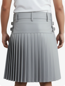 Gray pleated skirt worn by a person on a white background
