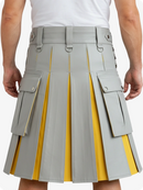 Gray and yellow pleated kilt worn by a person on a white background