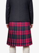 Person wearing a dark black jacket and red plaid kilt on a white background