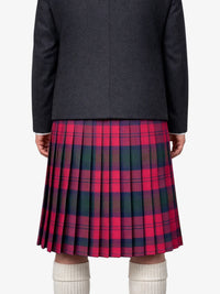 Person wearing a dark black jacket and red plaid kilt on a white background