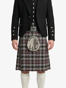 Person wearing a traditional Scottish kilt with a black jacket on a white background