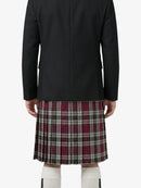 Person wearing a black coat and plaid kilt on a white background