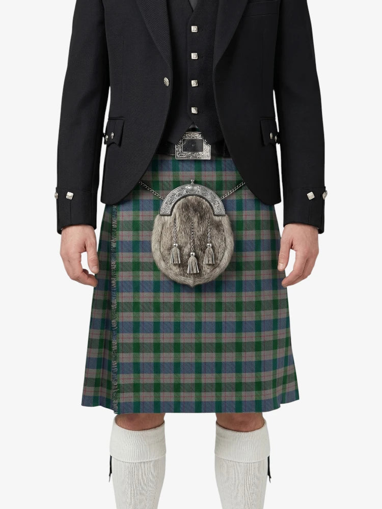 Person wearing a traditional Scottish kilt with a jacket and sporran on a white background