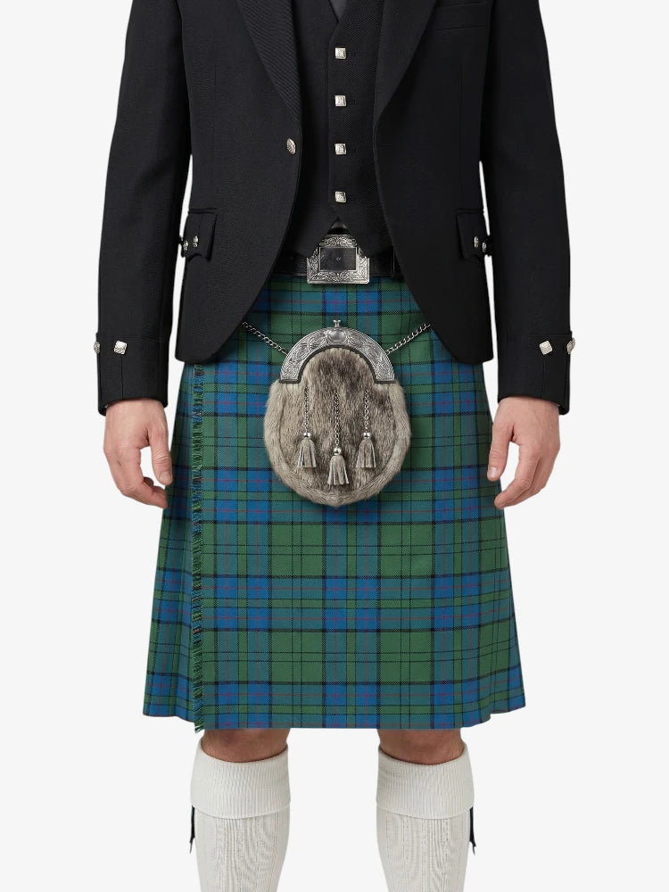 Person wearing a traditional Scottish kilt with a tartan pattern on a white background