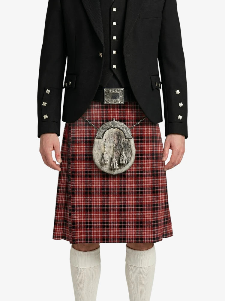 Person wearing a black jacket and red plaid kilt with a silver sporran on a white background