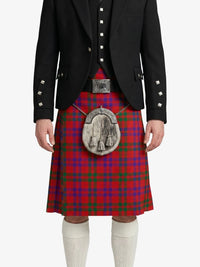 Person wearing a red tartan kilt with a black jacket on a white background