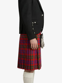 Person wearing a black blazer and red plaid kilt on a white background
