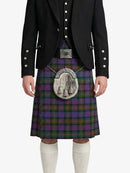 Person wearing a black jacket and tartan kilt with a silver sporran on a white background
