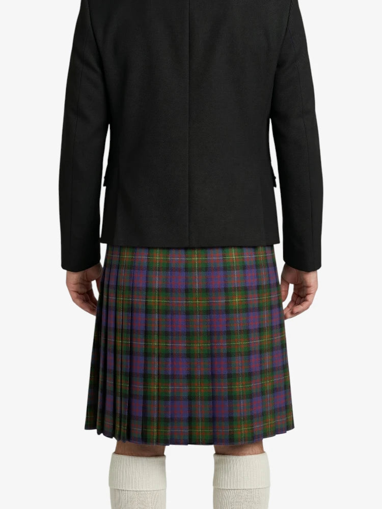 Person wearing a black jacket and a plaid kilt on a white background