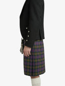 Person wearing a black jacket and plaid skirt on a white background