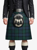 Person wearing a traditional Scottish kilt with a sporran on a white background