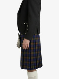 Person wearing a black blazer and plaid kilt on a white background