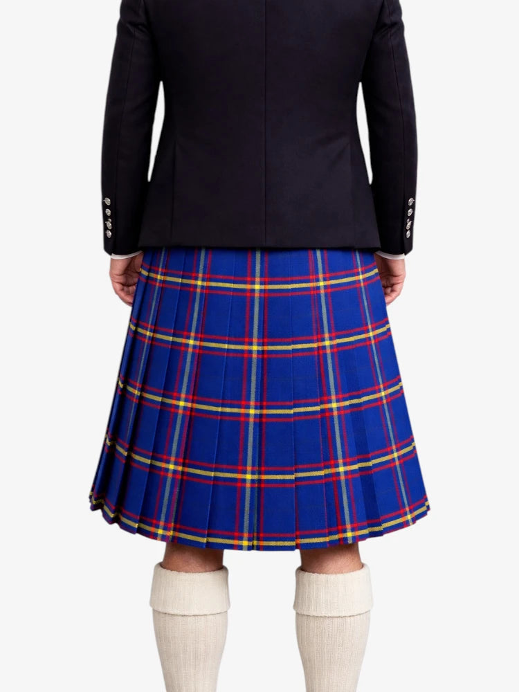 Person wearing a black jacket and blue plaid kilt on a white background