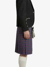 Person wearing a black blazer and red plaid kilt on a white background