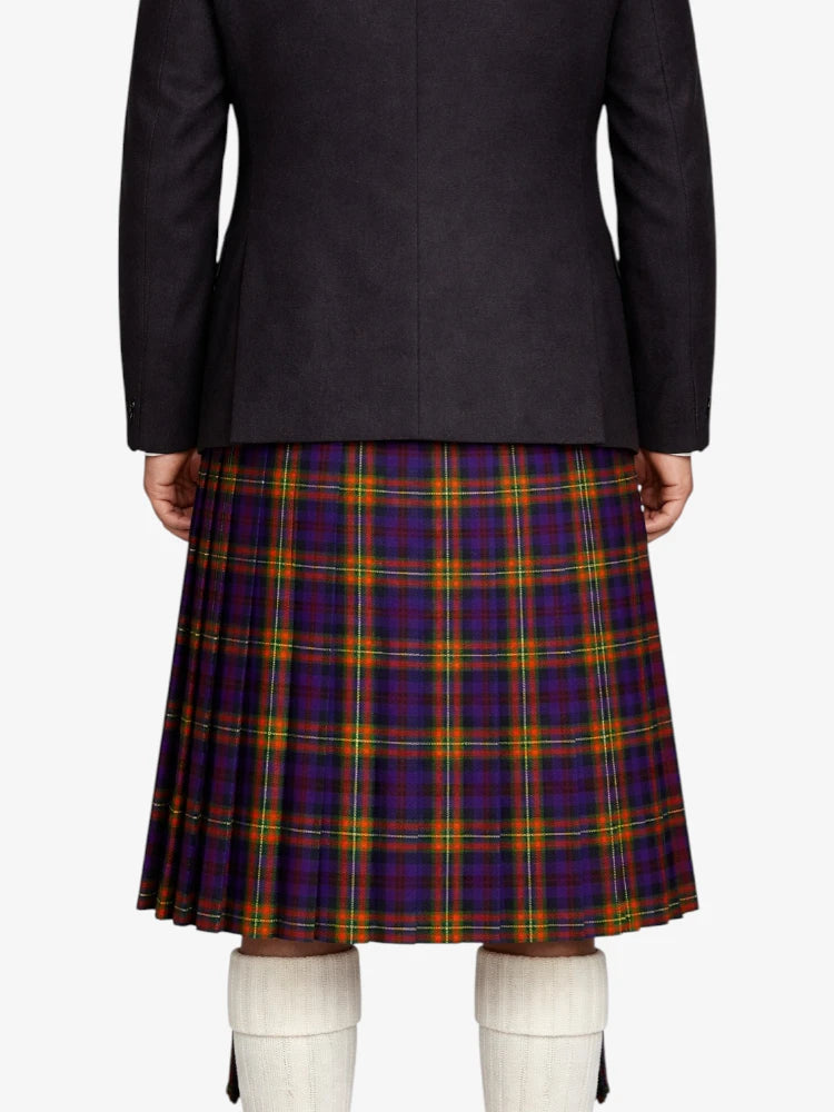 Person wearing a black  jacket and plaid kilt on a white background
