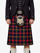 Person wearing a traditional Scottish kilt with a visible tartan pattern on a white background