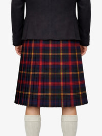 Person wearing a black jacket and red plaid kilt on a white background