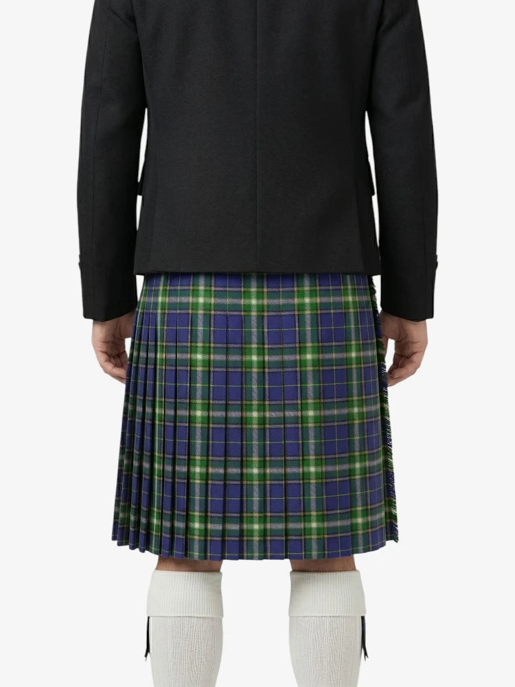 Person wearing a black jacket and plaid kilt on a white background