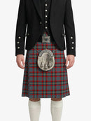 Person wearing a traditional Scottish kilt with a jacket on a white background