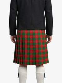 Person wearing a black jacket and red plaid kilt on a white background