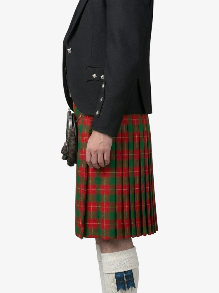 Person wearing a black jacket and red plaid kilt on a white background