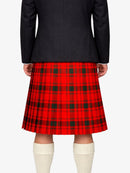 Person wearing a black jacket and red plaid kilt on a white background
