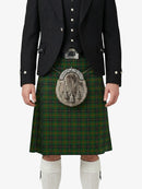 Person wearing a traditional Scottish kilt with a tartan pattern on a white background