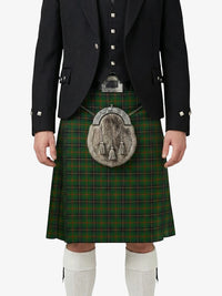 Person wearing a traditional Scottish kilt with a tartan pattern on a white background