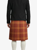 Person wearing a black jacket and plaid skirt on a white background