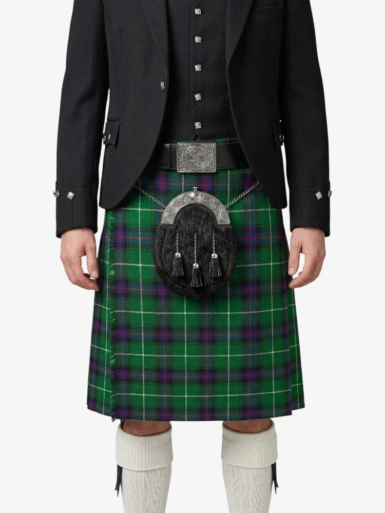 Person wearing a green plaid kilt with a black jacket on a white background