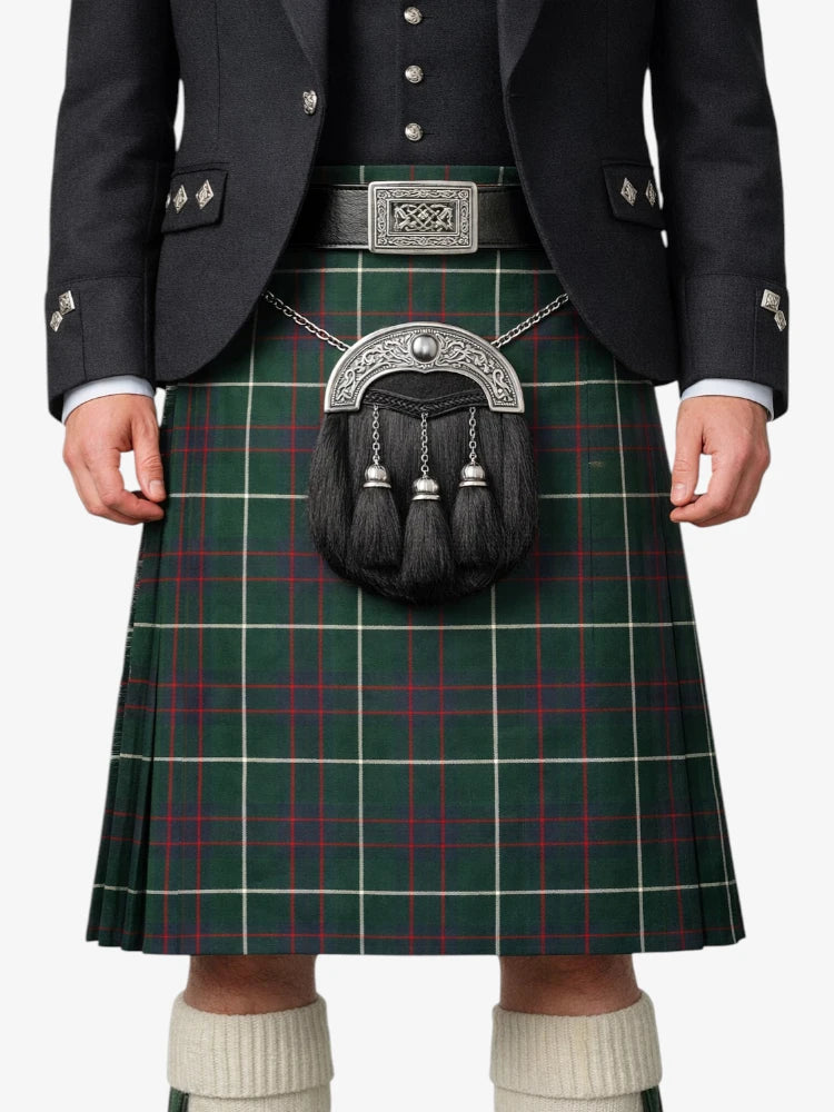 Person wearing a green plaid kilt with a dark jacket and white socks.
