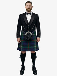 Man wearing a traditional Scottish mackenzie tartan kilt with a white background