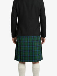 Person wearing a black jacket and green plaid kilt on a white background