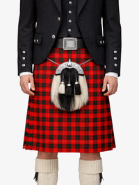 Person wearing a traditional Scottish kilt with a tartan pattern on a white background
