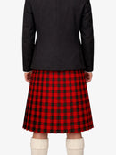 Person wearing a black coat and red plaid kilt on a white background