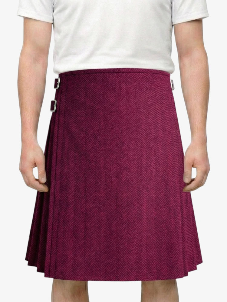 Person wearing a purple skirt with a white top on a white background