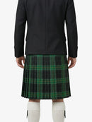 Person wearing a black coat and green plaid kilt on a white background