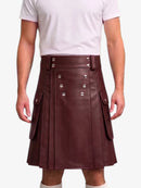 A person wearing a dark brown faux-leather kilt with silver-tone double-breasted buttons and side cargo pockets, paired with a white t-shirt and white socks, shown against a plain white background.