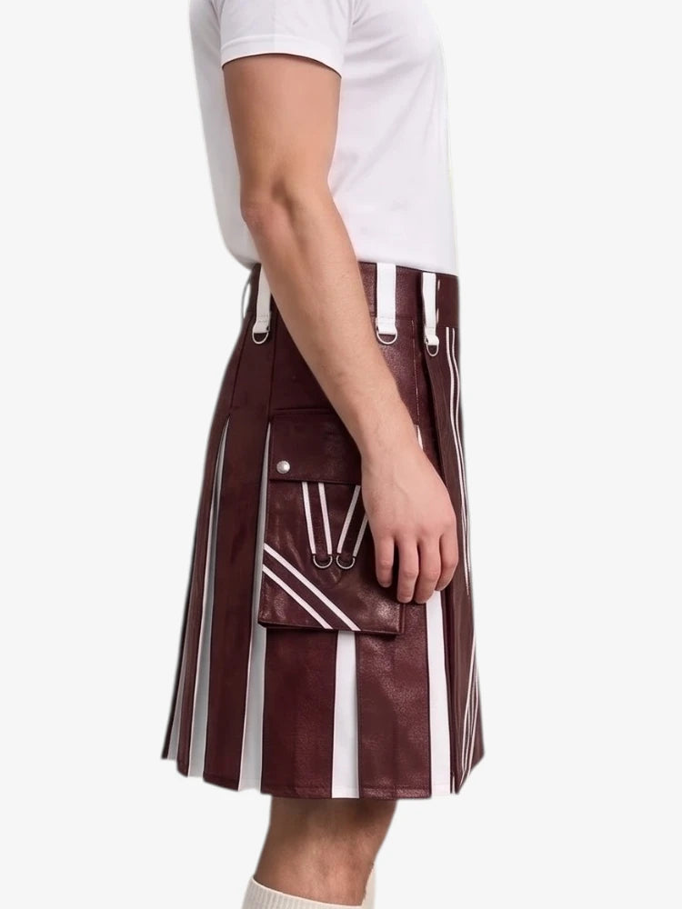 A side-profile view of a person wearing a pleated kilt in a deep burgundy faux leather with bold white vertical stripes and white drawstrings, paired with a white t-shirt against a plain white background.