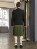 Man wearing a black jacket and green plaid kilt in an indoor setting.