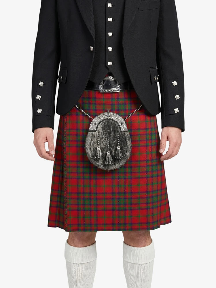 Person wearing a black jacket and red plaid kilt with a silver sporran on a white background